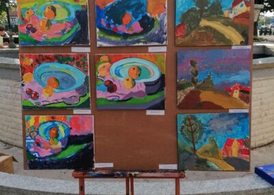 Outdoor exhibition of children paintings after Paul Serusie and Camille Pissarro